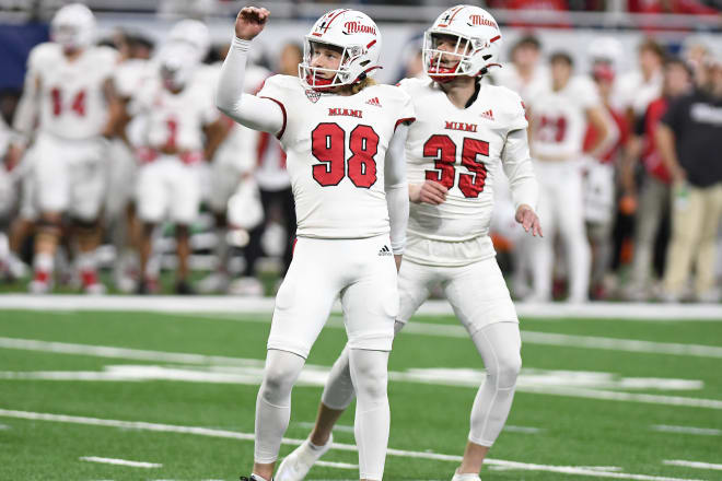 Miami (OH) Redhawks place kicker Graham Nicholson (98) and holder Alec Bevelhimer (35) watch as a field goal by Nicholson goes through the uprights against the Toledo Rockets in the first quarter at Ford Field. | Photo: Lon Horwedel-USA TODAY Sports