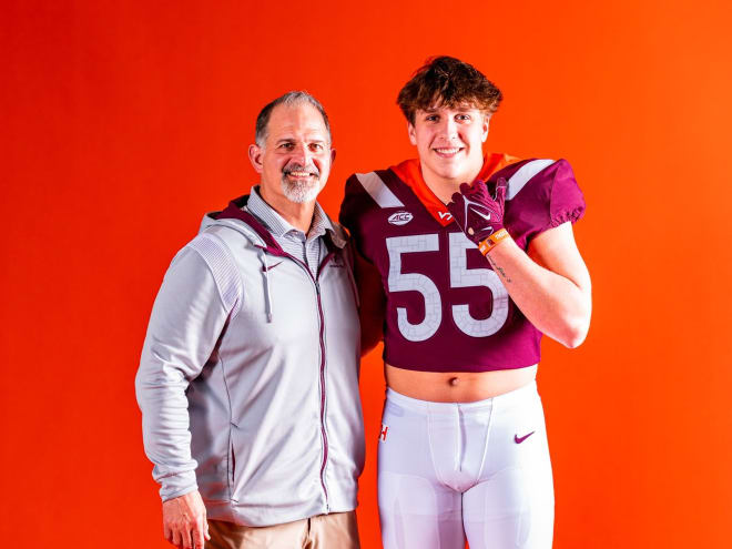 2024 offensive line recruit Anthony Knapp, right, poses for a photo with offensive line coach Joe Rudolph on a Virginia Tech visit in January. Rudolph is now Notre Dame's offensive line coach.