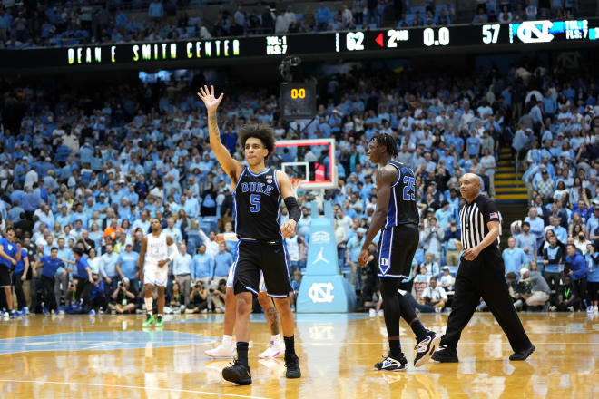 Freshman Tyrese Proctor waves to the crowd after Duke beat UNC. 