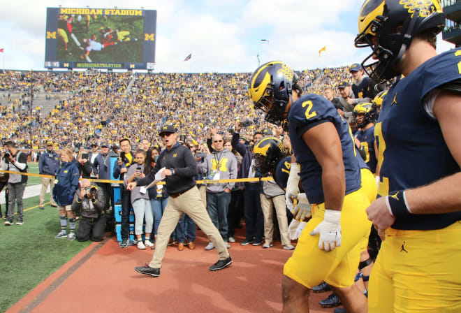 The Michigan Wolverines' football team will play at Illinois at noon on Saturday.