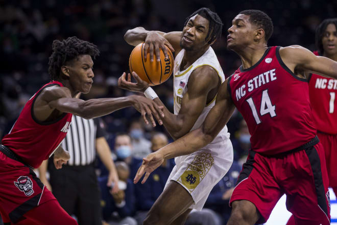 Notre Dame's Blake Wesley (center) gets pressure from North Carolina State's Terquavion Smith (left) and Casey Morsell (14) during the second half of an ACC men's basketball game Wednesday, Jan. 26, 2022, in South Bend, Ind. 