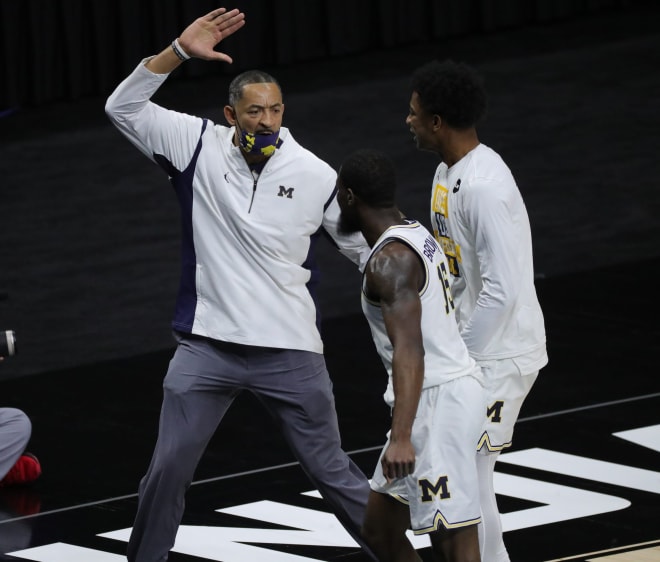 Juwan Howard connects with this players, sometimes in literal fashion, high-five style.