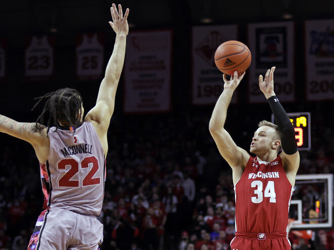 Wisconsin guard Brad Davison (34) shoots over Rutgers guard Caleb McConnell. Davison finished with 14 points.