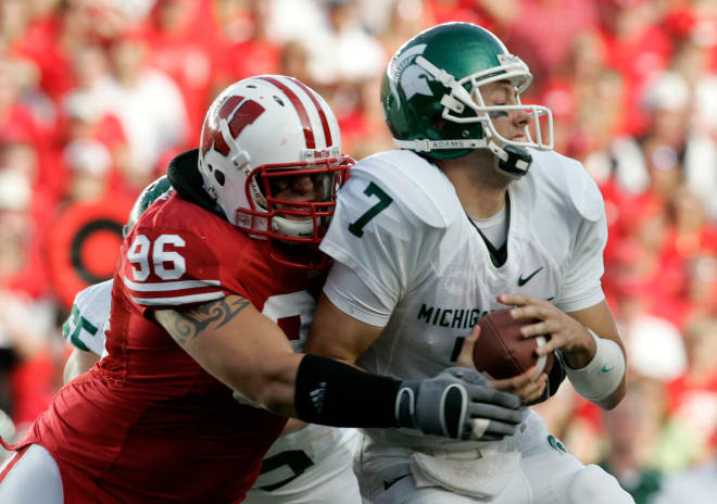 Wisconsin's Nick Hayden (96) sacks Michigan State quarterback Brian Hoyer, right, in 2007. Wisconsin won, 37-34.