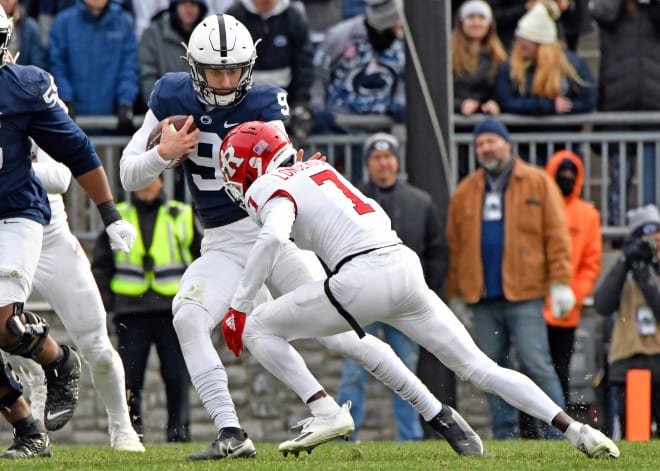 Penn State freshman quarterback Christian Veilleux eludes a Rutgers defender during a 28-0 win over the Scarlet Knights on Saturday.