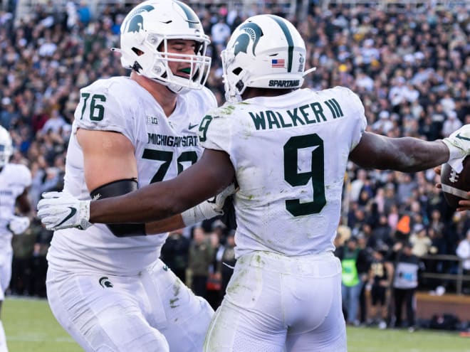 Michigan State Spartans running back Kenneth Walker III (9) celebrates his touchdown with offensive tackle Jarrett Horst (79) in the first half against the Purdue Boilermakers at Ross-Ade Stadium.