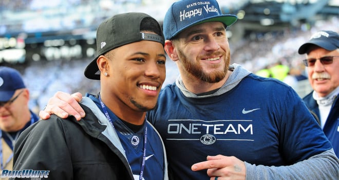 RB Saquon Barkley and LB Michael Mauti pose for a photo during the 2018 game against Michigan State.
