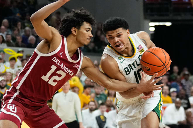 Baylor Bears guard RayJ Dennis (10) drives to the basket as Oklahoma Sooners guard Milos Uzan (12) defends 