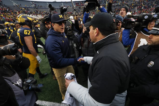 Michigan Wolverines football head coach Jim Harbaugh shakes hands with Ohio State head coach Ryan Day