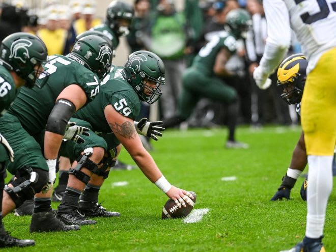 Michigan State center Nick Samac readies to snap the ball versus Michigan in 2021