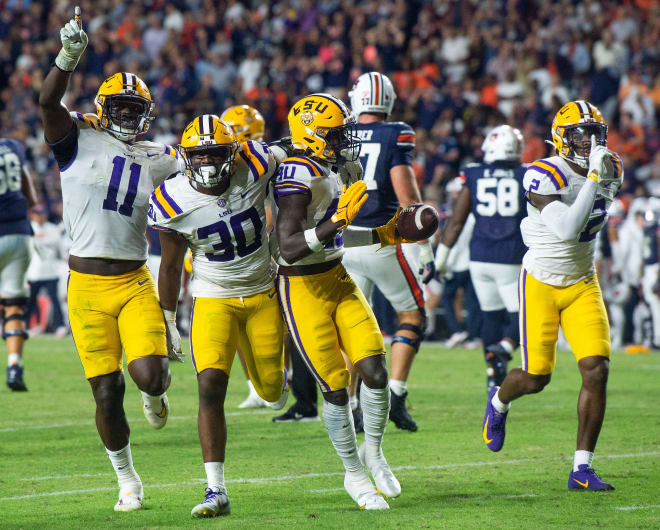 LSU Tigers defensive end Ali Gaye (11), linebacker Greg Penn III (30), linebacker Harold Perkins Jr. (40) and cornerback Mekhi Garner (2) celebrate an interception against Auburn as the Auburn Tigers take on the LSU Tigers at Jordan-Hare Stadium in Auburn, Ala., on Saturday, Oct. 1, 2022.