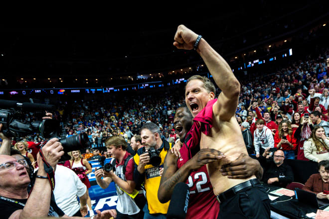 Arkansas head coach Eric Musselman celebrates Saturday's 72-71 win over Kansas in the second round of the NCAA Tournament.