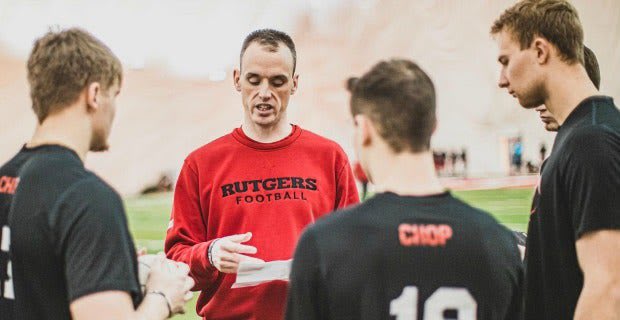 Rutgers OC Sean Gleeson talking to the quarterbacks