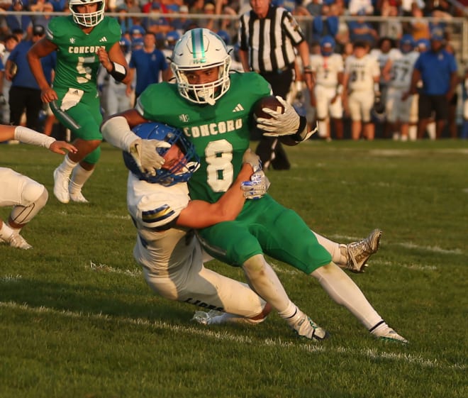 Concord senior Jaran Thomas (8) gets tackled by Elkhart senior Ben Cole during a football game Friday, Aug. 23, 2024, at Concord High School in Dunlap.