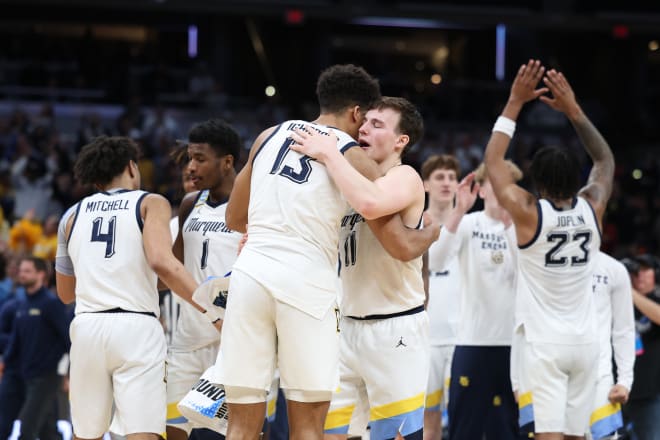 Marquette seniors Tyler Kolek, right, and Oso Ighodaro hug after the Golden Eagles defeated Colorado on Sunday to reach the Sweet 16.