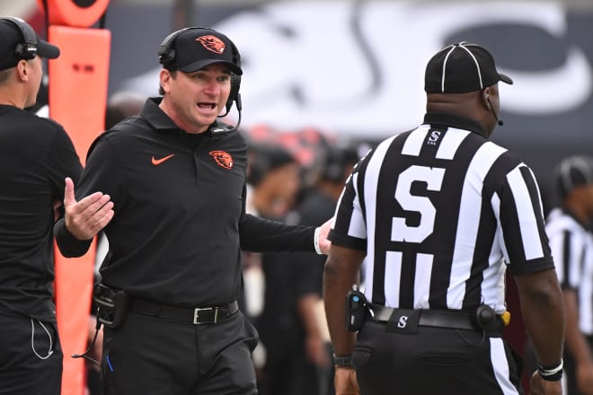 Oregon State Beavers head coach Jonathan Smith talks with an official during a game against the Washington State Cougars in the first half at Gesa Field at Martin Stadium, Sep 23, 2023; Pullman, Washington.