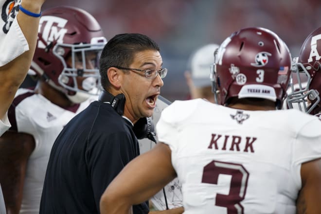 Texas A&M Aggies special teams coach Jeff Banks talks to his team during the college football game between the Arkansas Razorbacks and Texas A&M Aggies on September 23, 2017 at AT&T Stadium in Arlington, Texas. Texas A&M won the game 50-43 in overtime. Photo | Getty Images