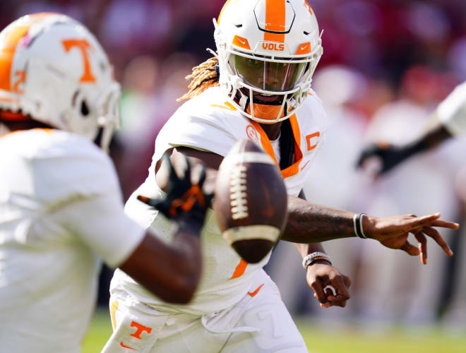 Oct 21, 2023; Tuscaloosa, Alabama, USA; Tennessee Volunteers quarterback Joe Milton III (7) pitches the ball against the Alabama Crimson Tide during the first half at Bryant-Denny Stadium. 