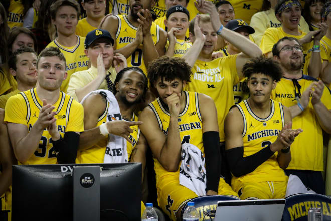 The team mugs with the Maize Rage postgame. 