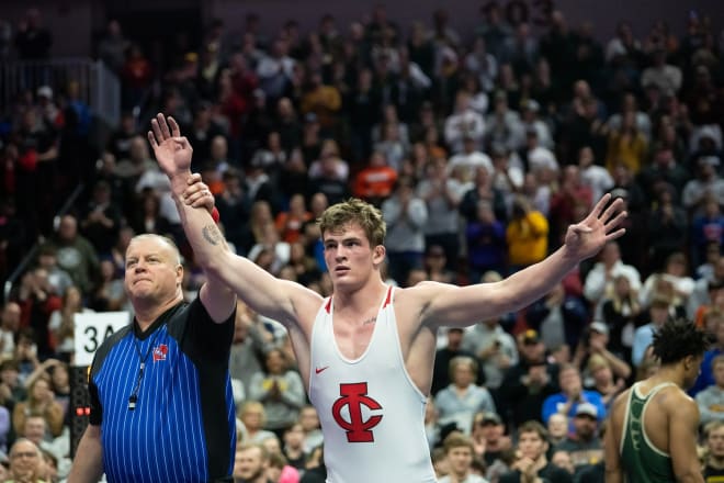 Ben Kueter wins his fourth Iowa state championship and finishes his career 111-0. 