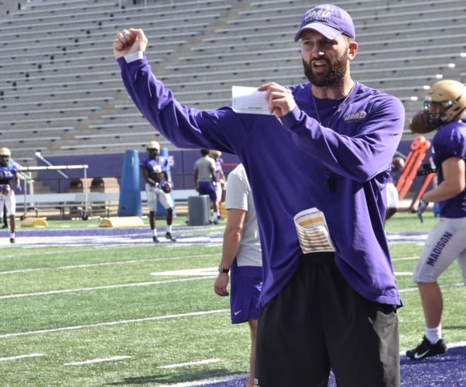 James Madison offensive coordinator Mike Shanahan instructs a drill during a practice earlier this month at Bridgeforth Stadium. 