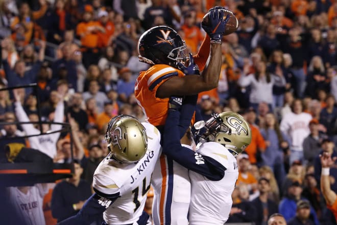 Dontayvion Wicks out-jumps a pair of Georgia Tech defenders for the first of his two TD catches on Saturday night.