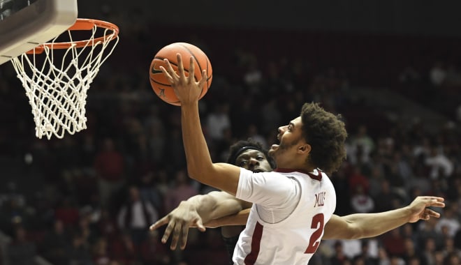 Alabama forward Darius Miles (2) goes to the hoop against Memphis forward Deanddre Williams (12) at Coleman Coliseum. Alabama defeated Memphis 91-88. Photo | Gary Cosby Jr.-USA TODAY Sports