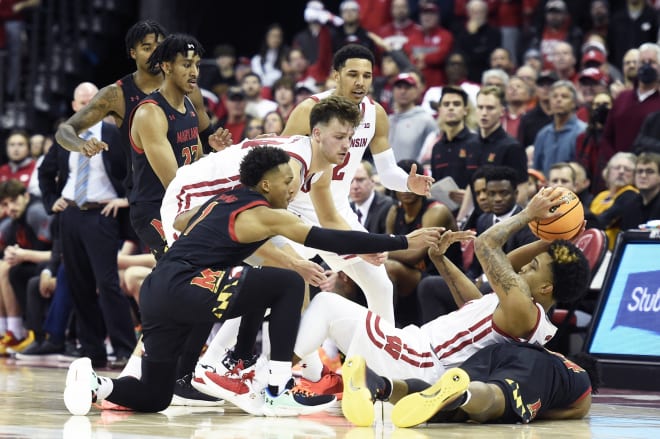 Jahmir Young (No. 1) tries to take the ball away from Wisconsin's Chucky Hepburn. 