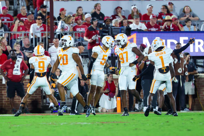 Sep 21, 2024; Norman, Oklahoma, USA; Tennessee Volunteers defensive lineman Bryson Eason (20) and Tennessee Volunteers defensive back Christian Harrison (5) and Tennessee Volunteers defensive lineman Jayson Jenkins (97) celebrates with teammates after a safety against the Oklahoma Sooners during the second quarter at Gaylord Family-Oklahoma Memorial Stadium. 