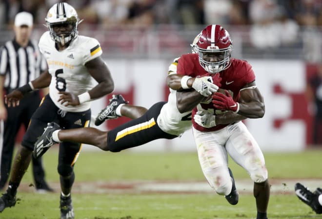 Alabama Crimson Tide running back Roydell Williams (23) runs the ball against Southern Miss Golden Eagles defensive back Jay Stanley (21) at Bryant-Denny Stadium. Alabama won 63-14. Photo | USA Today