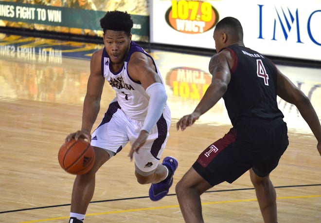 Jayden Gardner drives for two of his 29 points to go along with 13 rebounds in a 67-63 ECU win over Temple.