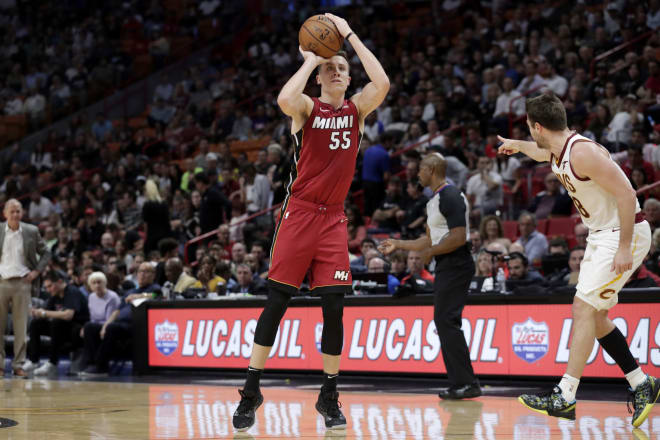 Former Michigan Wolverines head basketball coach John Beilein looks on (left) as his former player Duncan Robinson (middle) had 29 points for the Heat against the Cavs.