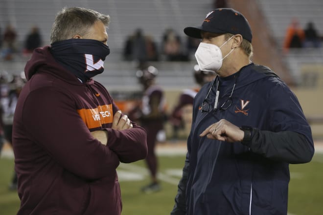 Virginia Tech coach Justin Fuente (left) and Virginia coach Bronco Mendenhall chat before the Hokies' win over the Cavaliers' earlier this month in Blacksburg. 