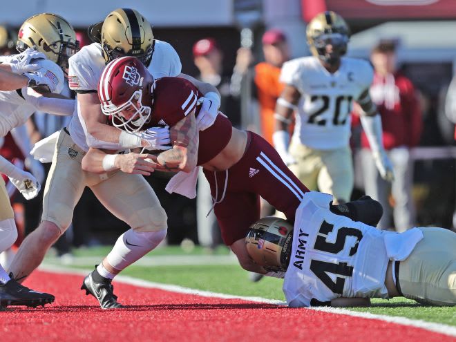 Minutemen QB Gino Campiotti (5) hits paydirt in the 1st quarter for the only UMass score on the day