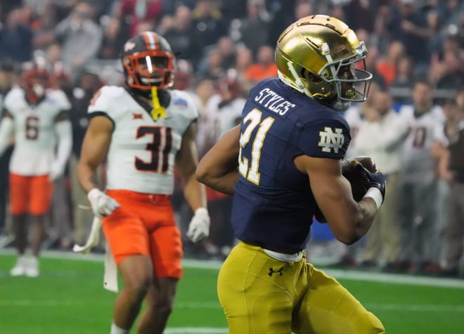 Notre Dame wide receiver Lorenzo Styles (21) scores a touchdown in the first half of the Fiesta Bowl, Saturday at State Farm Stadium against Oklahoma State.