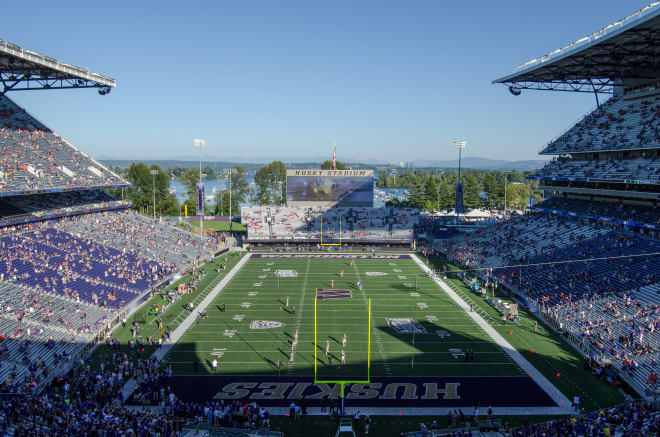 Husky Stadium beckons the Wolverines and traveling fans — if there is a regularly scheduled football opener.