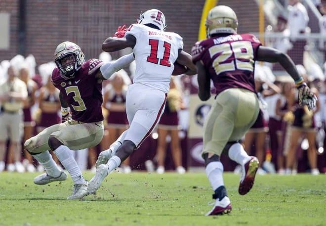 Florida State safety Derwin James loses his footing against Jakobi Meyers in a 27-21 loss to N.C. State.