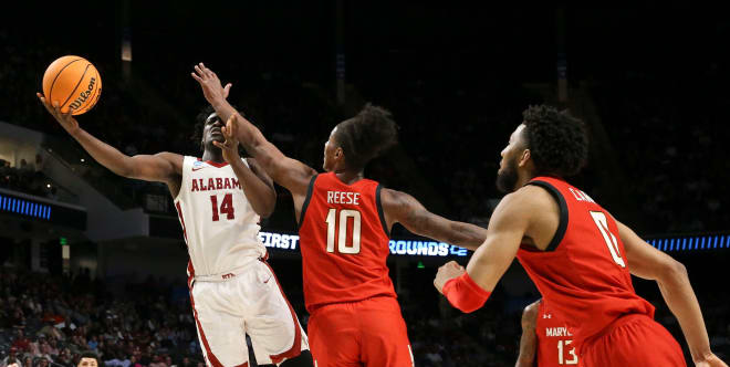 Alabama center Charles Bediako (14) shoots against defense by Maryland forward Julian Reese (10) at Legacy Arena during the second round of the NCAA Tournament. Alabama advanced to the Sweet Sixteen with a 73-51 win over Maryland. Photo | Gary Cosby Jr.-Tuscaloosa News 
