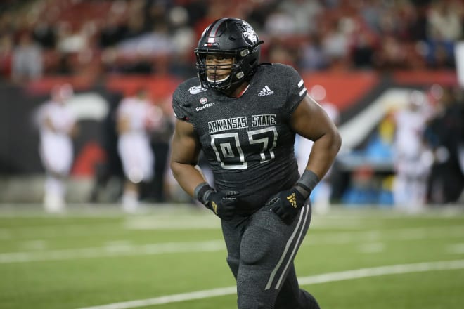 Defensive tackle Terry Hampton is transferring from Arkansas State to Arkansas.