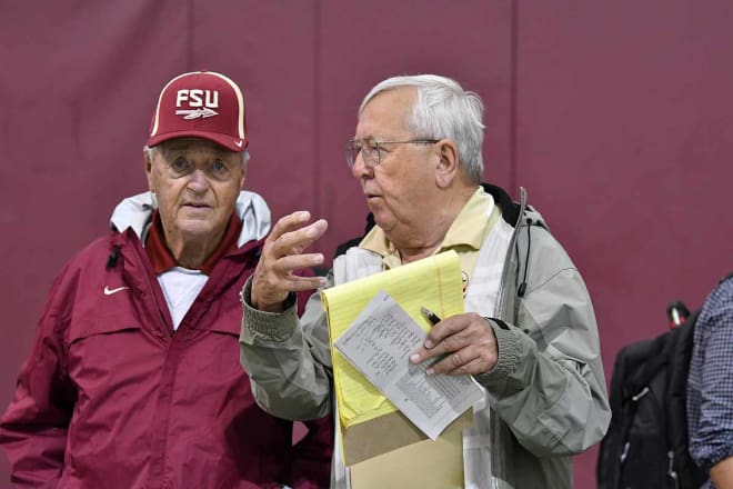Bobby Bowden meets with the voice of the Seminoles, Gene Deckerhoff, during Wednesday's practice at Florida State. 