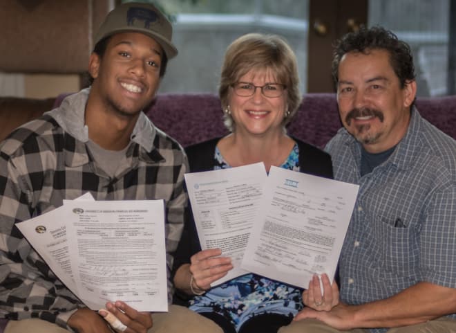 Collins with Vince and Lisa Reyes on National Signing Day 2016