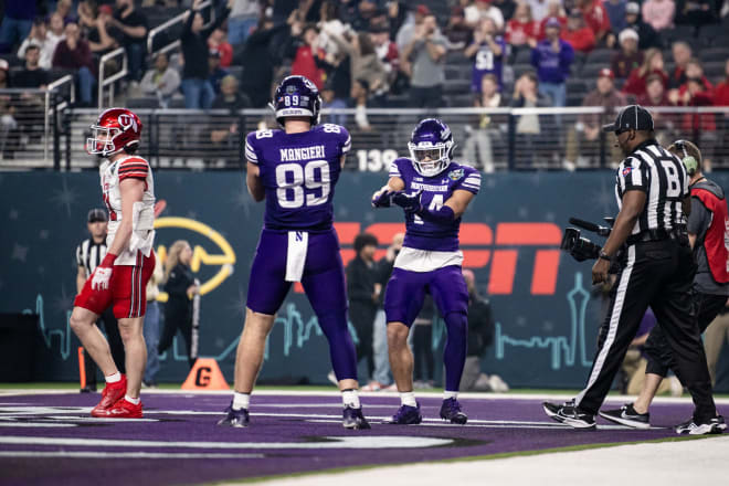 Cam Johnson and Charlie Mangieri celebrate Johnson's second quarter touchdown.