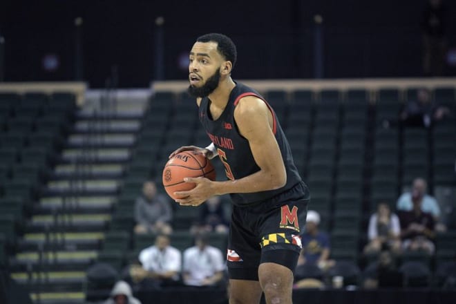 Eric Ayala leads Maryland into Assembly Hall on Monday. (AP Photo/Phelan M. Ebenhack) (Phelan M. Ebenhack/AP)