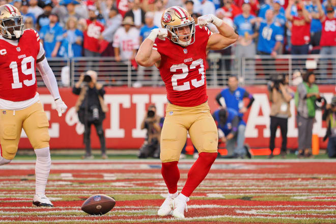 Christian McCaffrey celebrates after scoring his first touchdown against the Lions. 