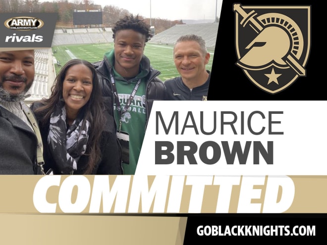 Maurice Brown is joined by his dad and mom, along with Army Head Coach Jeff Monken during his visit to West Point