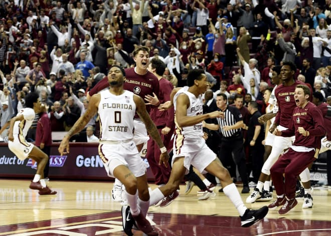 FSU basketball players celebrate last week's overtime victory against Duke.