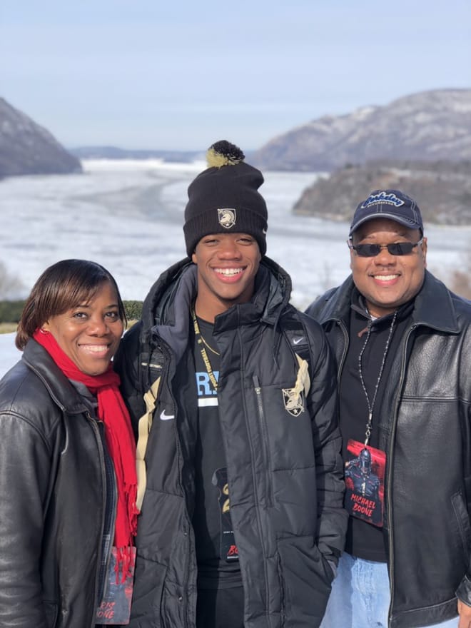 CB prospect Tim Boone and parents with the frozen Hudson River as their backdrop