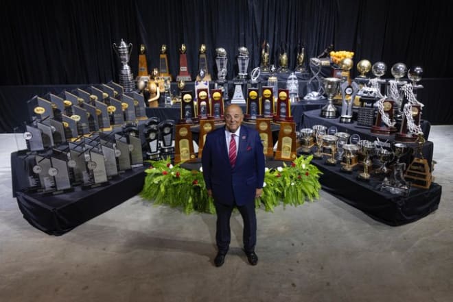 Barry Alvarez poses with the trophies the teams in his athletic department have won during his 17-year tenure