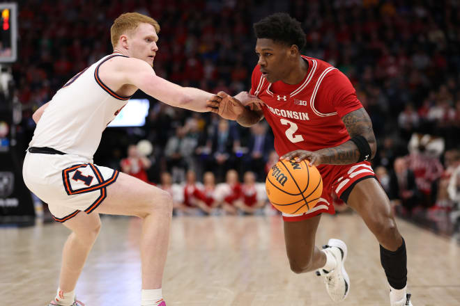 Wisconsin Badgers guard AJ Storr (2) plays the ball defender by Illinois Fighting Illini guard Luke Goode (10) in the first half Target Center.