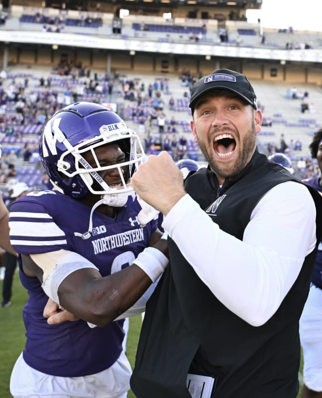 Wide receiver AJ Henning celebrates with Braun after his first win as a head coach, over UTEP.